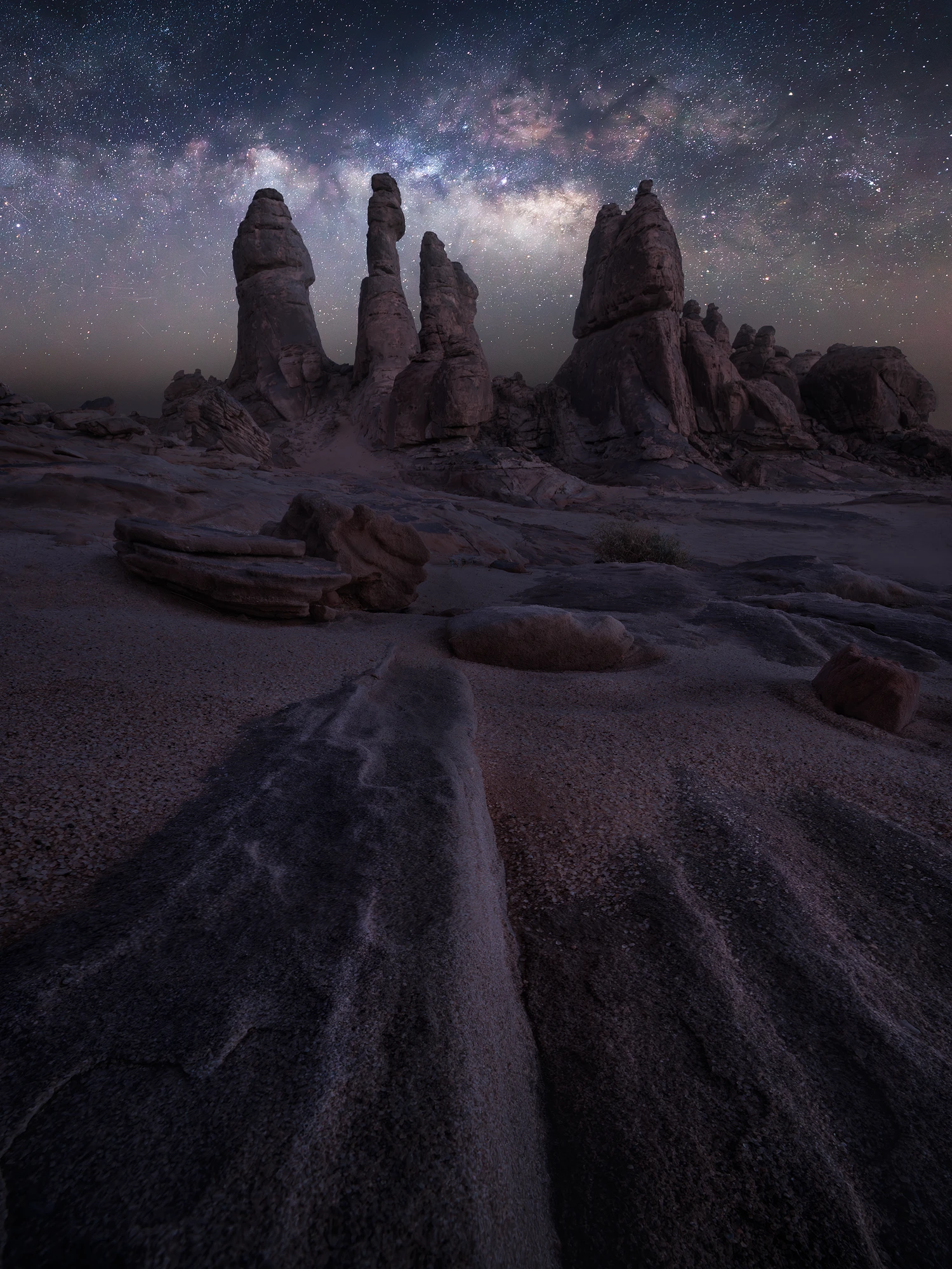 Milky Way above sandstone rock formations in AlUla desert, Saudi Arabia.