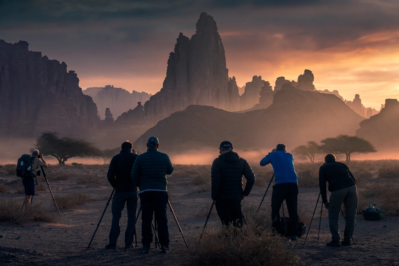 Photographers capturing sunrise light and desert atmosphere during a landscape photography tour in Al Disah Valley - Tabuk, Saudi Arabia