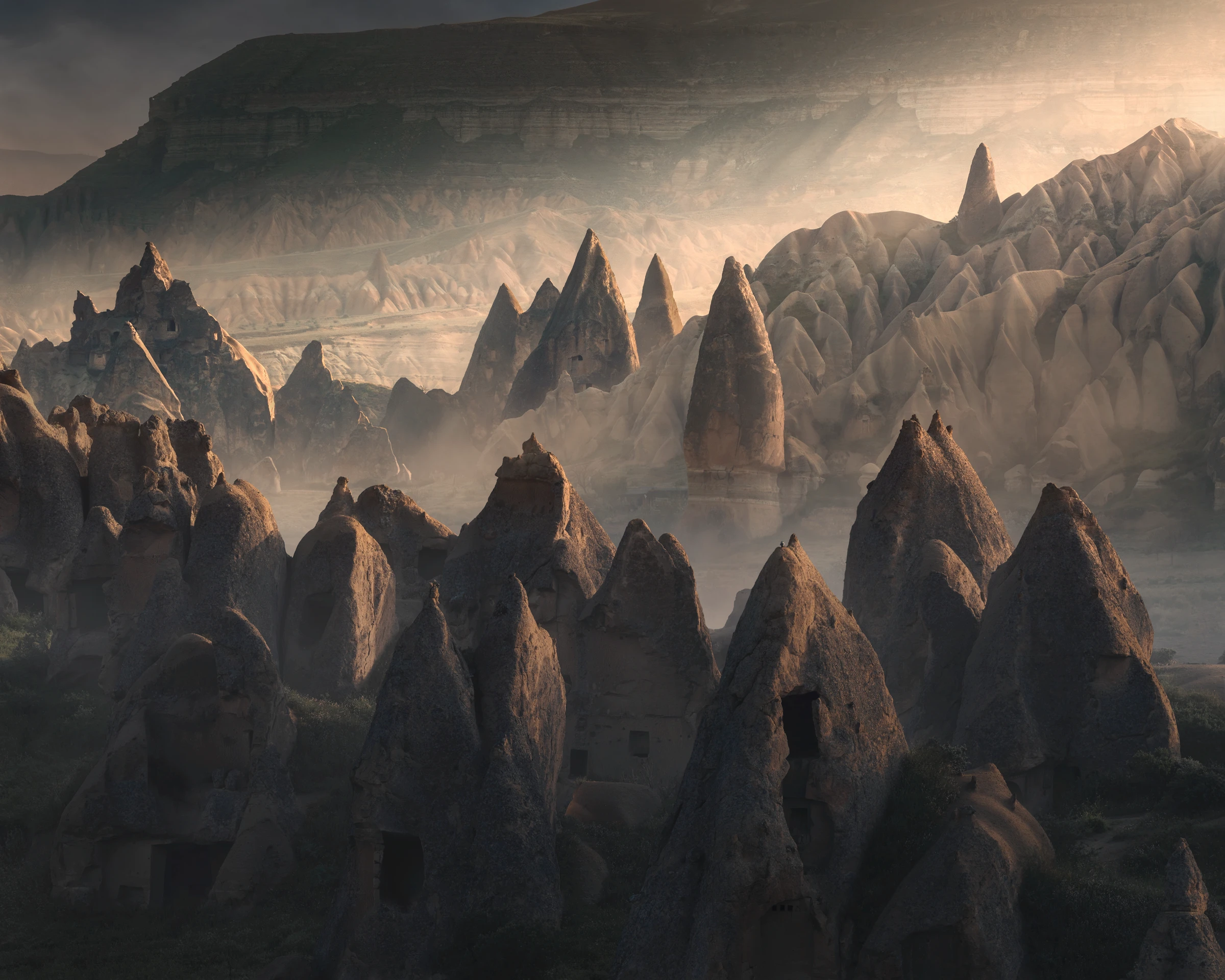 Echoes of a Forgotten Age Cappadocia fairy chimneys and ancient rock formations illuminated by soft morning light in Turkey